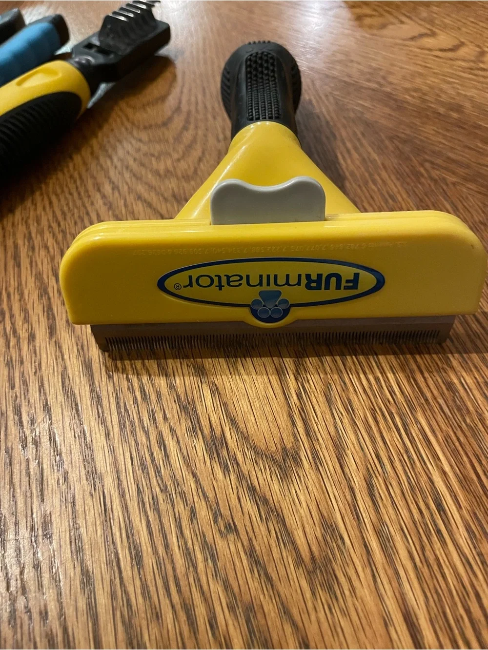 FURminator Yellow and Black Deshedding Tool with Blue-Accented Nail Clippers